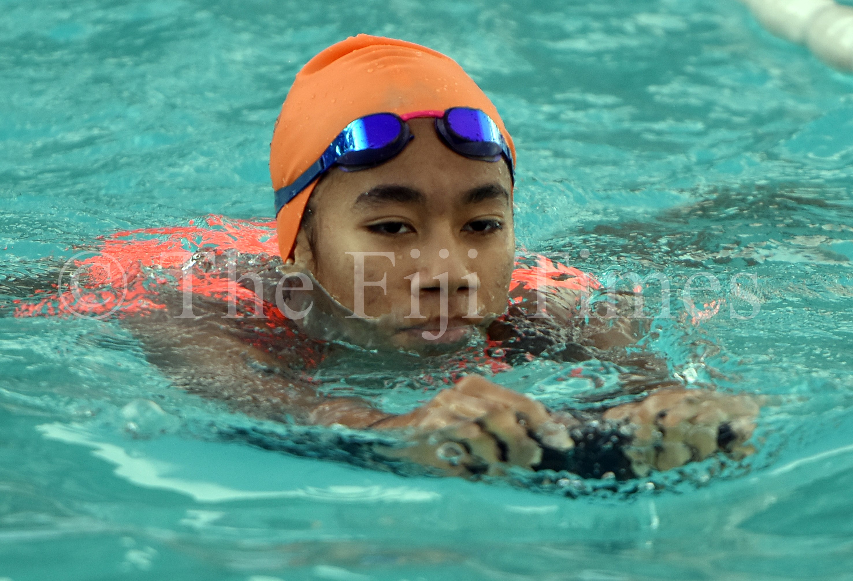 Fijian teen swimmer Muller sets her course.
